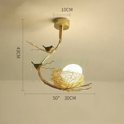 Modern golden nest glass led ceiling lamp with gold-toned metal bird-themed design for living room decor