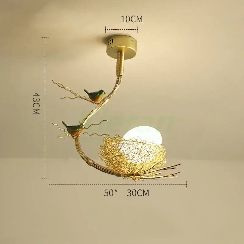 Modern golden nest glass led ceiling lamp with gold-toned metal bird-themed design for living room decor