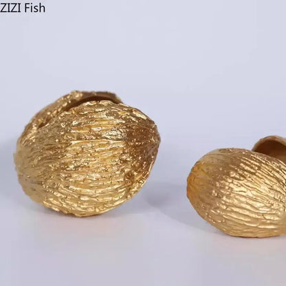 Modern golden nut shell ornaments with textured metallic finish for living room decorbites golden nut desk decor