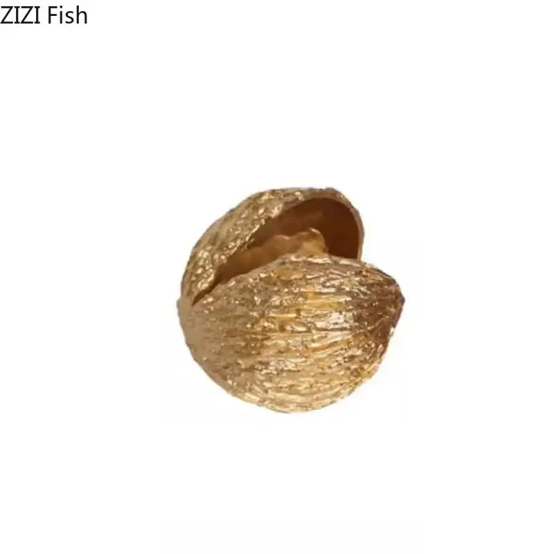 Modern decorbites golden nut shell ornament with textured golden shell design for living room desk decor