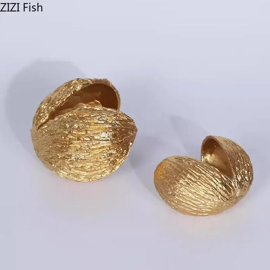 Modern golden nut shell ornaments desk decor featuring textured metallic golden nut shell decorative boxes