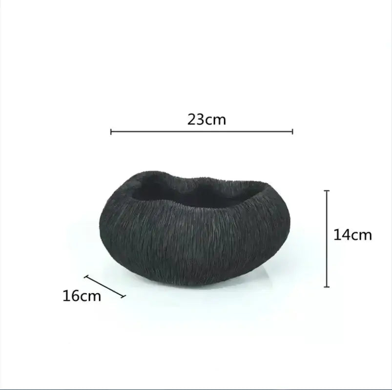 Modern golden octopus spherical ornament featuring a black textured hair bun design measuring 23cm by 16cm by 14cm decorbites golden octopus