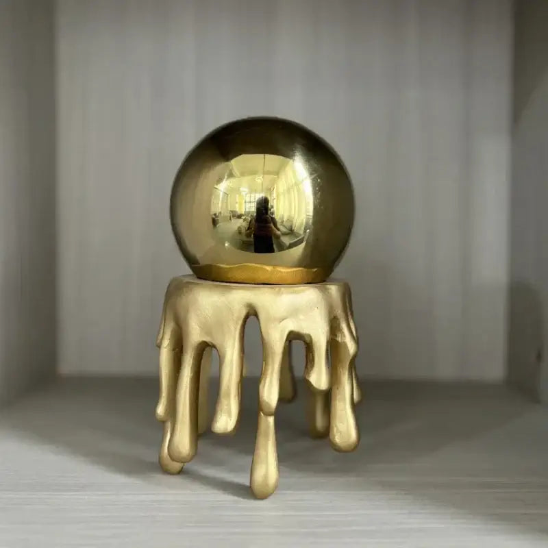 Modern golden octopus spherical ornament with molten metallic design on golden base for living room decorbites golden octopus