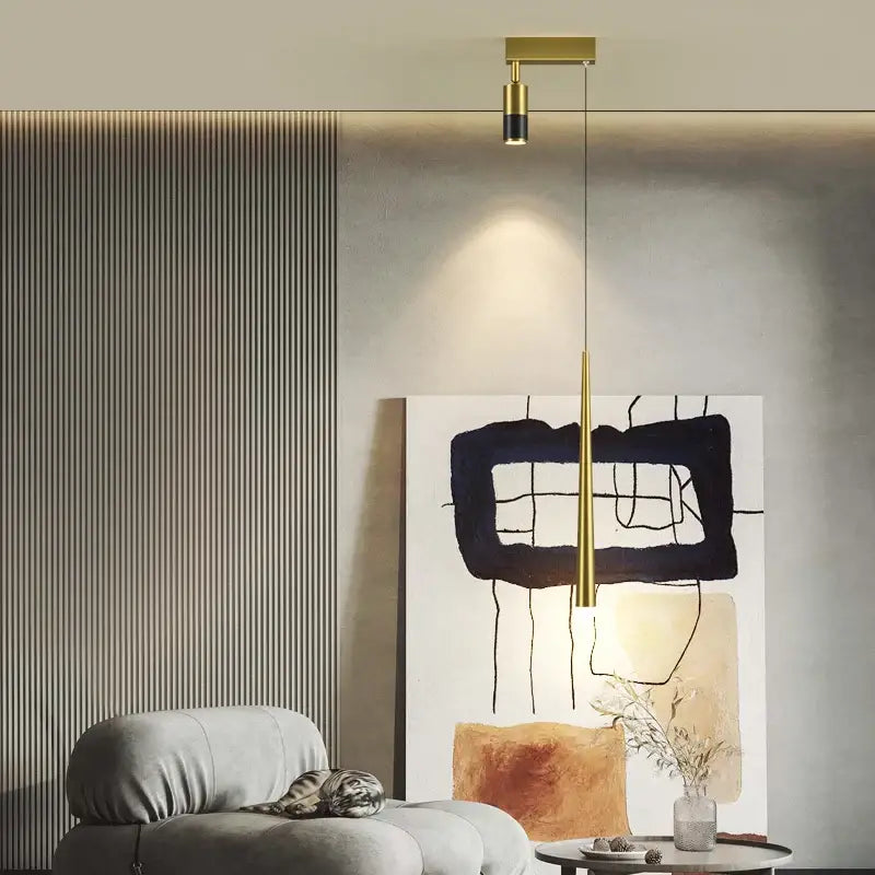 Modern golden pendant chandelier with gold-toned minimalist cylindrical light and black accent by decorbites golden pendant