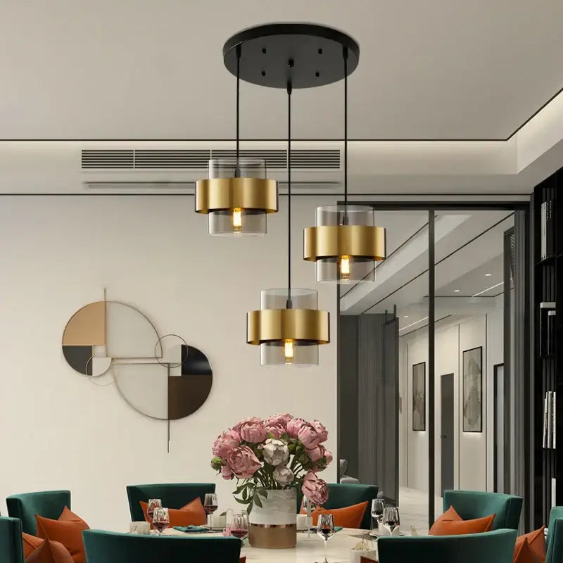 Modern golden pendant lights with clear glass and gold-finished cylindrical shades for bedroom decorbites pendant lights