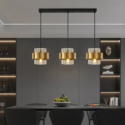 Modern three-light decorbites golden pendant lights with brushed gold cylindrical shades and clear glass for bedroom decor