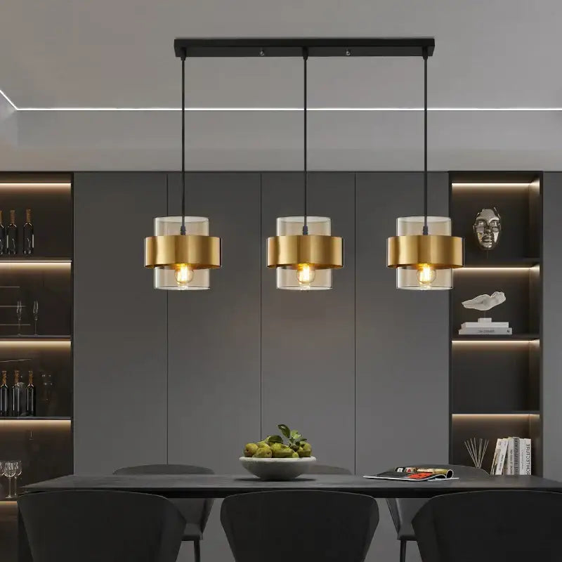 Modern three-light decorbites golden pendant lights with brushed gold cylindrical shades and clear glass for bedroom decor