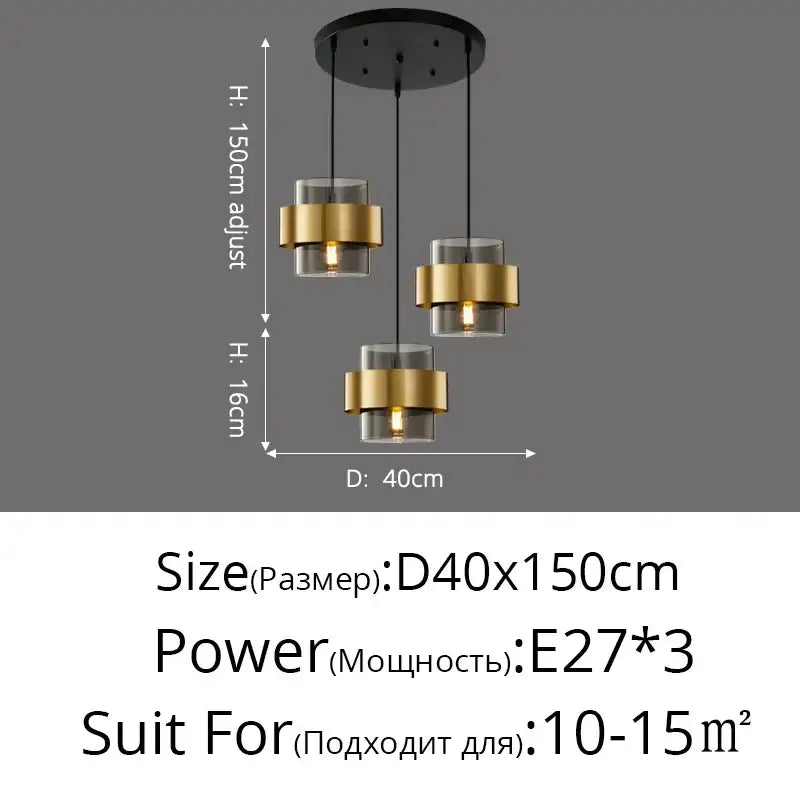 Modern golden pendant lights featuring three gold-finished metal rings and clear glass shades in a bedroom chandelier decorbites design