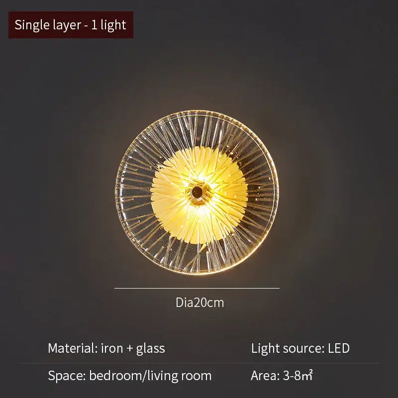 Modern golden radial crystal wall lamp with clear glass and iron construction emits warm yellow light for living room decorbites crystal wall
