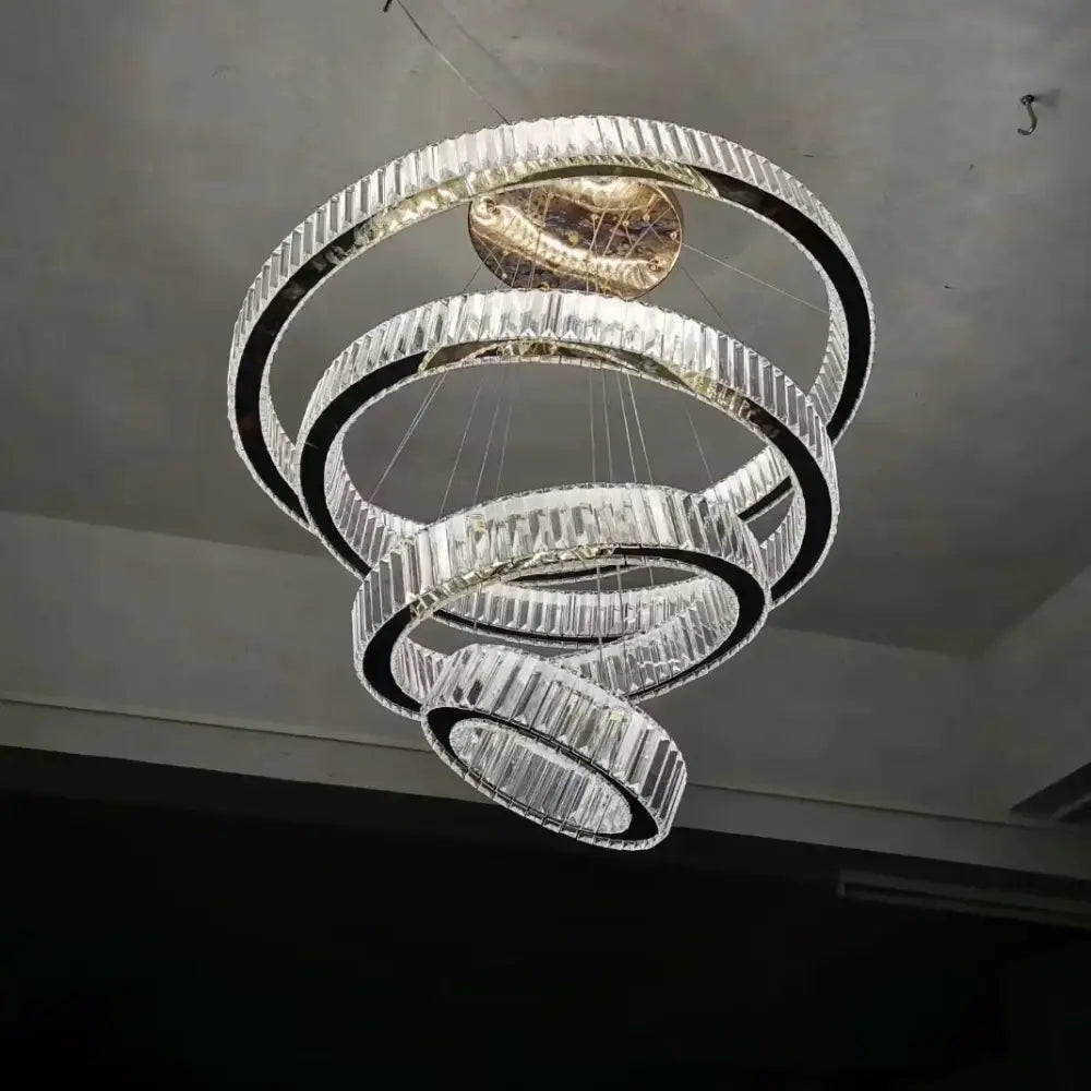 Modern golden spiral crystal round chandelier with faceted crystals and sleek metallic finish by decorbites crystal round