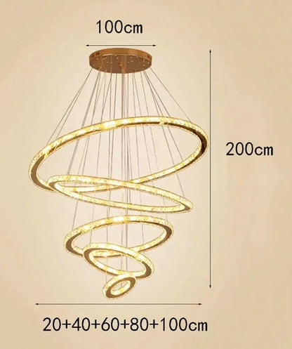 Modern golden spiral crystal stair chandelier with multiple glowing rings suspended from circular ceiling mount
