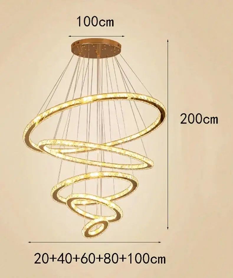 Modern golden spiral crystal stair chandelier with multiple glowing rings suspended from circular ceiling mount
