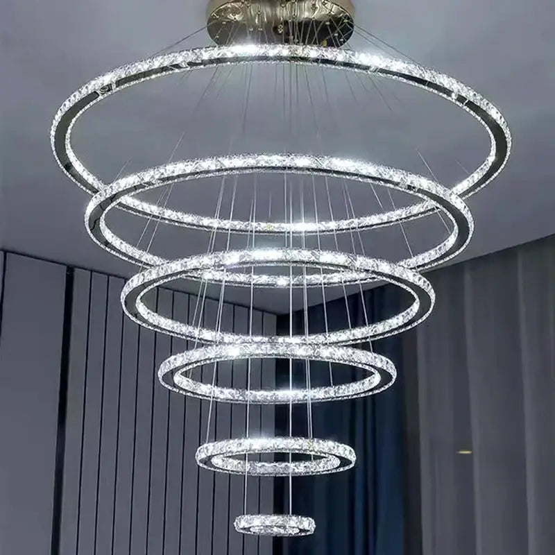 Modern golden spiral crystal stair chandelier with cascading rings of clear crystals and bright white led lights for living room