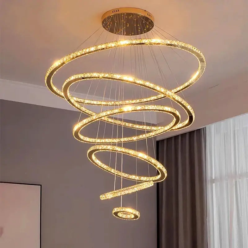 Modern golden spiral crystal stair chandelier with crystal-encrusted rings and warm led lighting for living room