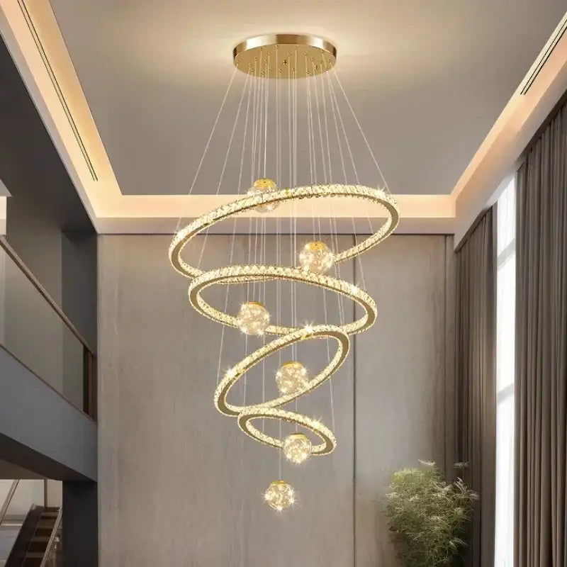 Modern golden spiral decorbites crystal led chandelier with crystal accents and spherical light fixtures for living room