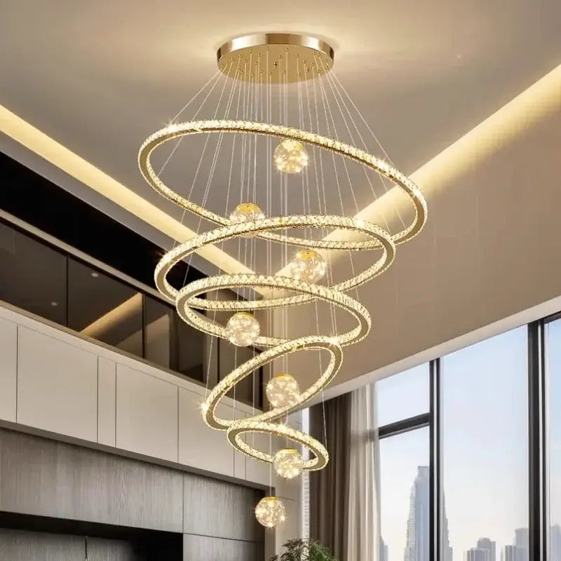 A modern golden spiral decorbites crystal led chandelier with concentric rings and polished brass mount for living room