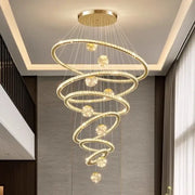 Modern golden spiral decorbites crystal led chandelier with crystal-encrusted rings and spherical accents for living room