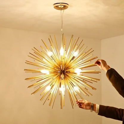 Modern golden starburst geometric ball chandelier with exposed bulbs radiating from a brass central hub for dining room decorbites geometric ball chandelier