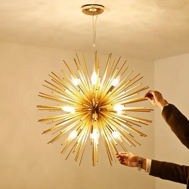 Modern golden starburst geometric ball chandelier with exposed bulbs radiating from a brass central hub for dining room decorbites geometric ball chandelier