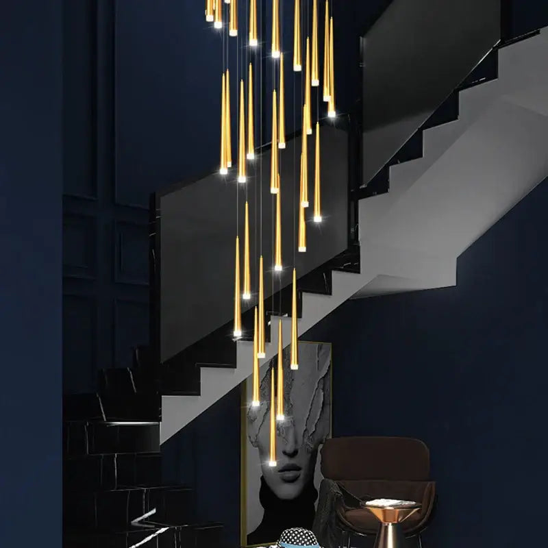 Modern decorbites golden tapered chandelier led pendant light with golden cylindrical lights in cascading arrangement for living room