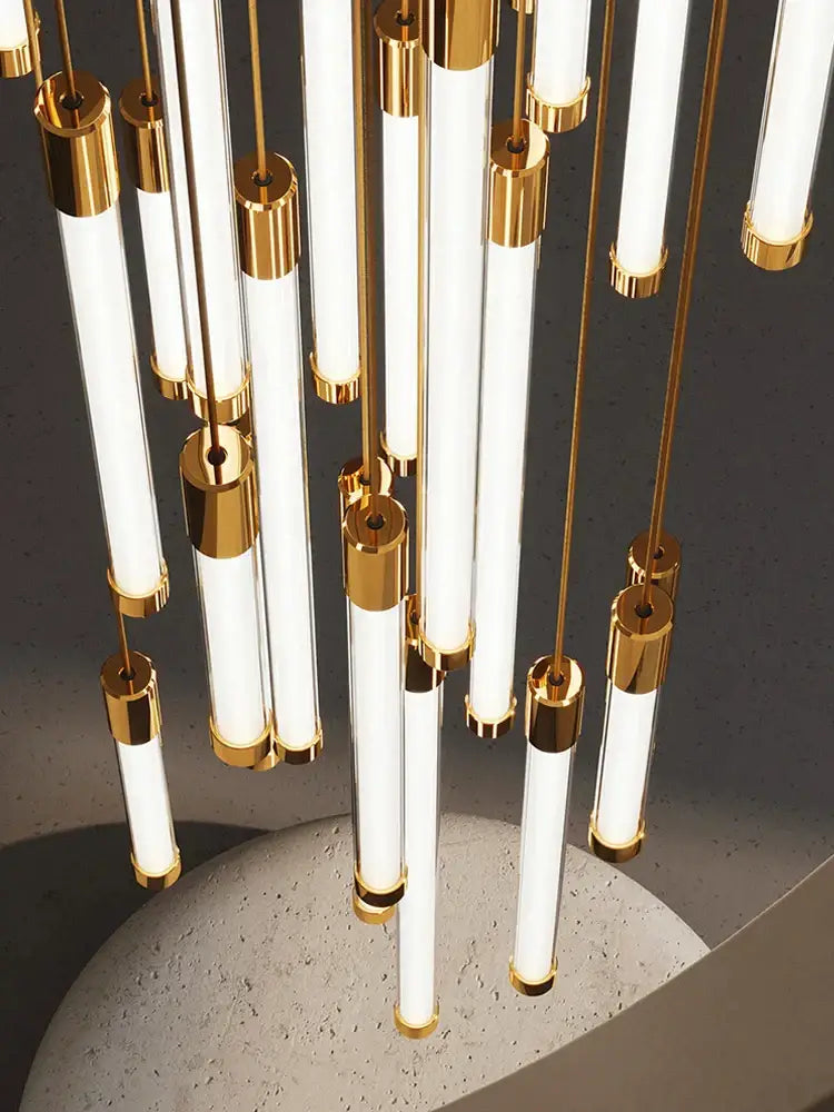 Modern golden tube chandelier with slender white cylindrical glass tubes and polished gold metal fittings by decorbites golden tube