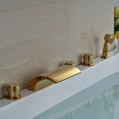 Modern golden widespread brass bathtub faucet with sleek curved spout and three cylindrical handles for bathroom use