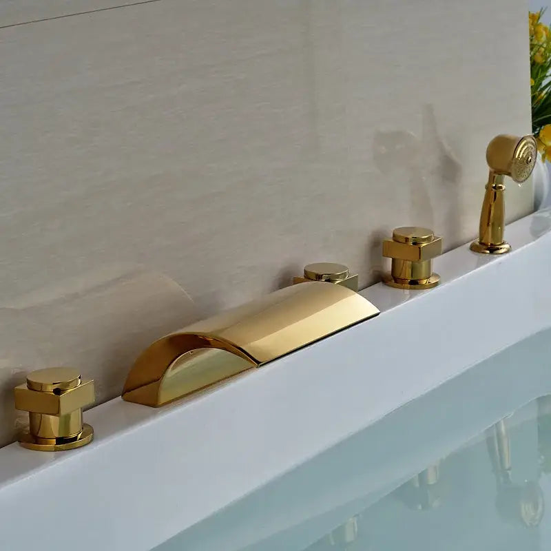 Modern golden widespread brass bathtub faucet with handheld shower in a sleek polished metallic finish