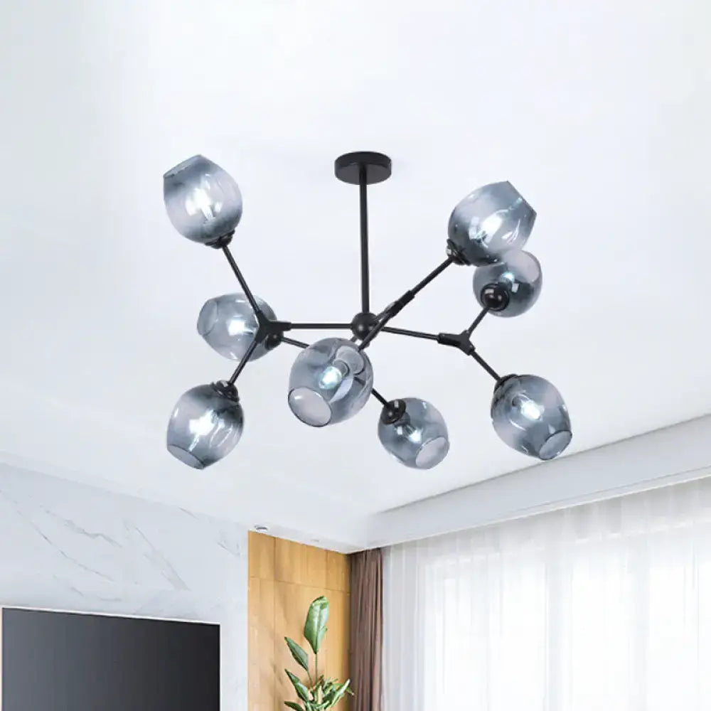 Modern black metal chandelier with multiple frosted gray glass globes for living room featuring gradient blue glass accents