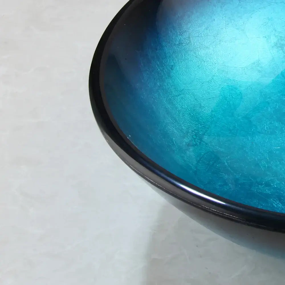 Modern gradient blue glass sink set featuring a glossy crackled blue glass sink with a dark rim for bathroom decorbites use