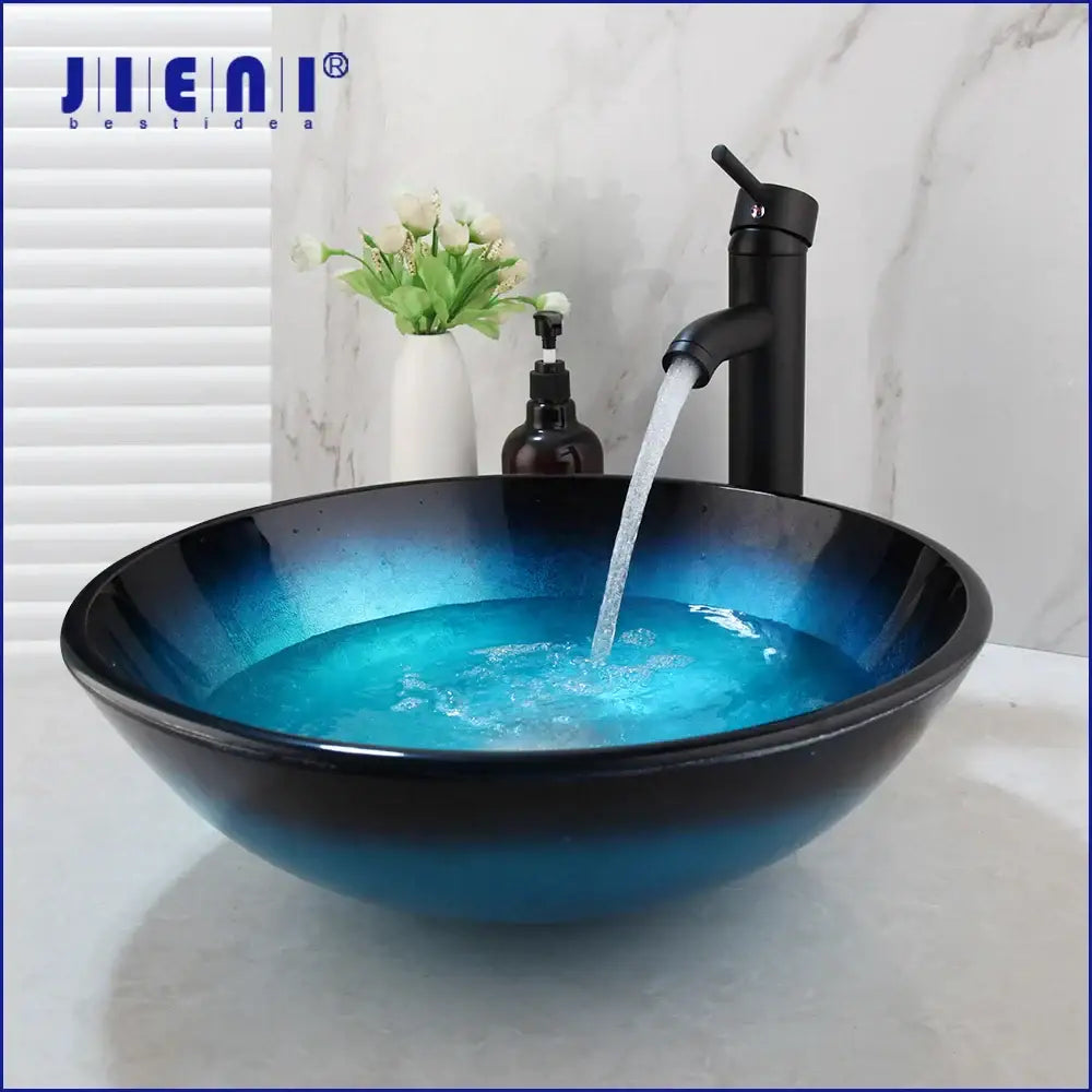 Modern gradient blue glass vessel sink set featuring a sleek glossy finish and black rim for bathroom decorbites blue glass sink