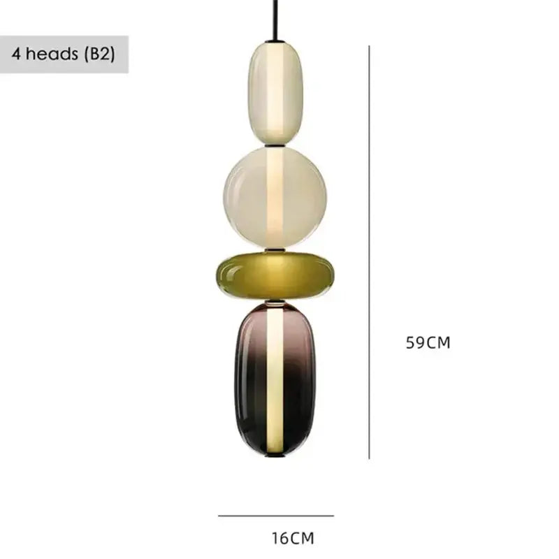 Modern glass pendant light with four stacked translucent orbs in cream olive green and dark gradient hues for dining room