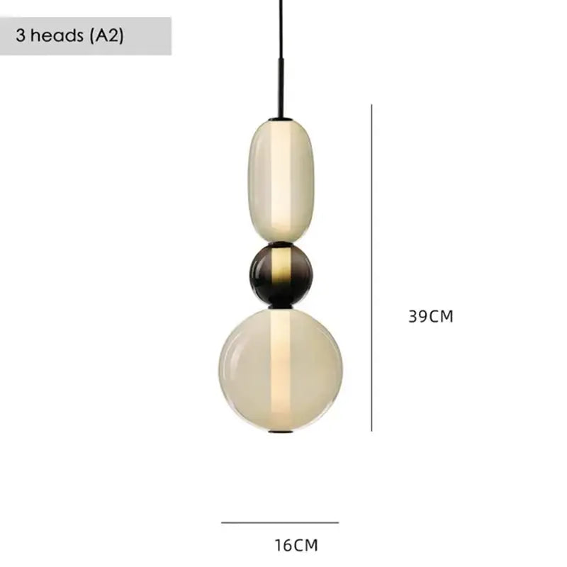 Modern gradient black and white glass pendant light with three stacked orbs featuring a warm glow for dining room