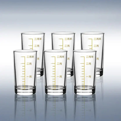Clear glass spirit set brandy cups with gold-colored chinese measurement markings for modern dining use