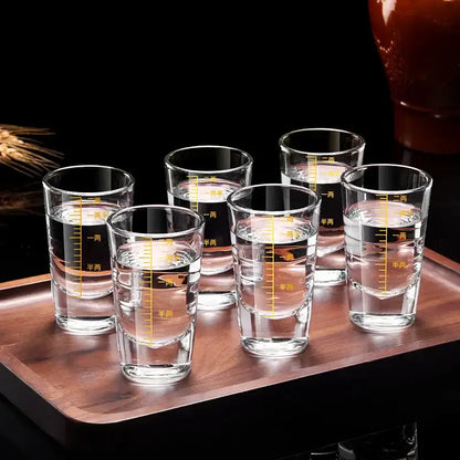 Set of six clear glass brandy cups with yellow Chinese measurement markings on a wooden tray glass spirit set
