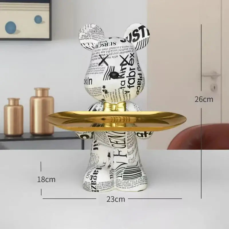 White bear figurine with black newspaper print holding a gold tray modern graffiti bear figurine decorbites tray decor