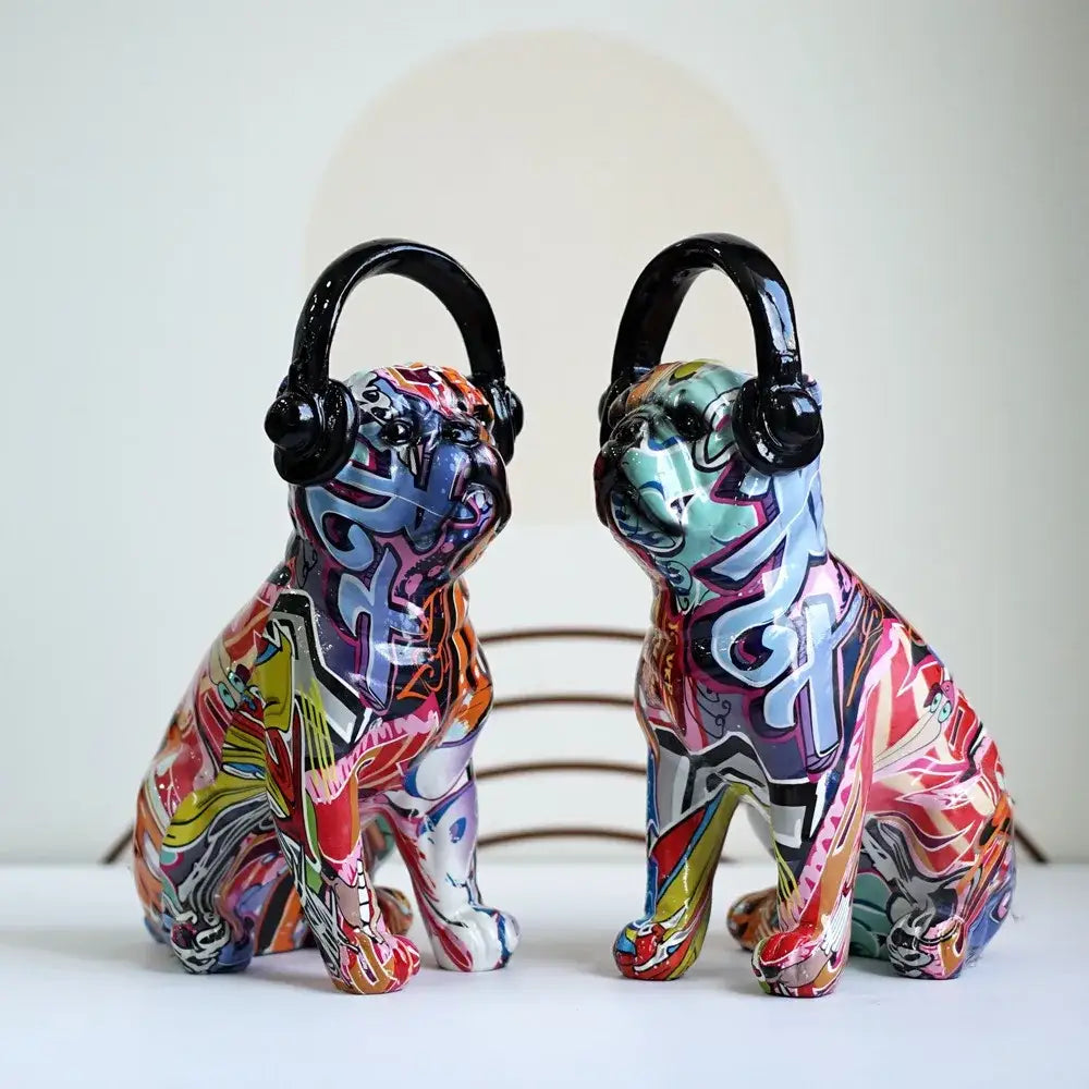 Two vibrant colorful bulldog sculptures in graffiti style ceramic wearing black headphones for living room decorbites decor