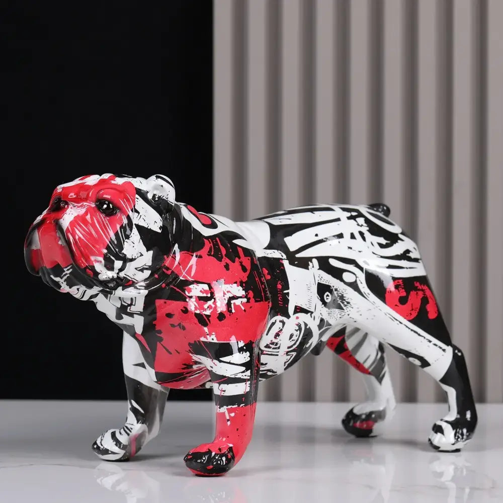 A glossy stylized decorbites bulldog figurine with bold red black and white graffiti design for living room decor
