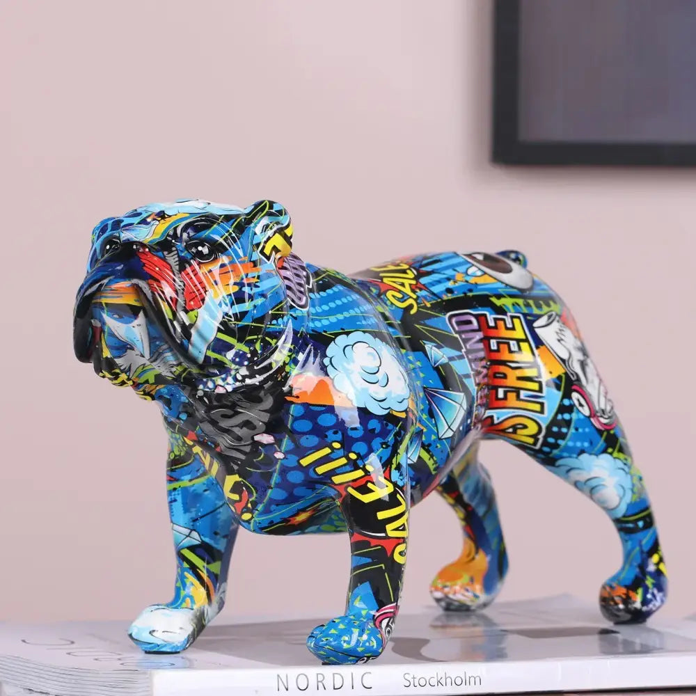 Vibrant blue decorbites bulldog figurine with comic graffiti art and bold yellow red white text for living room decor
