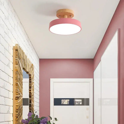Pink circular ceiling light with wooden base featuring decorbites acrylic wood led for modern bedroom decor