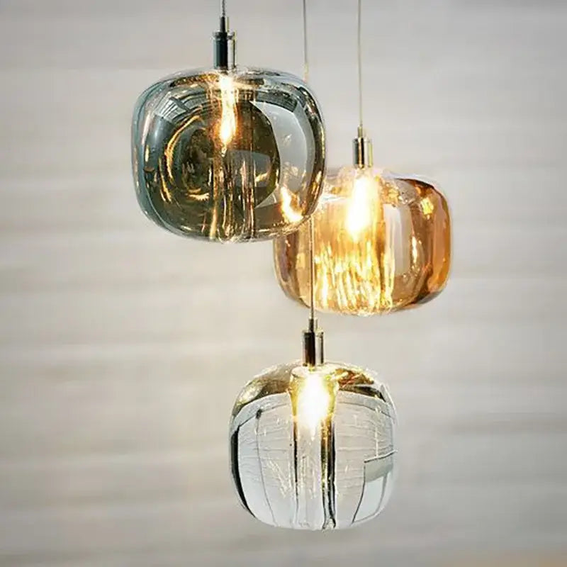 Three modern gray amber and clear crystal pendant lights with frosted textured finish for bedroom kitchen decorbites light luxury