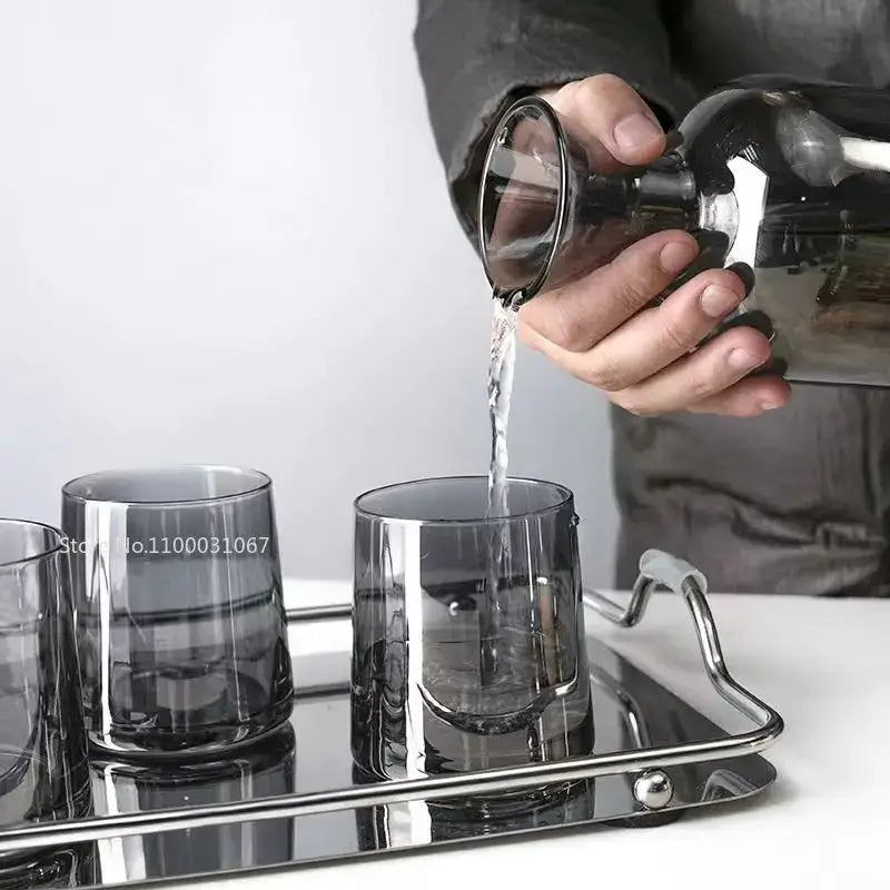 Modern gray amber glass water pitcher with wood stopper and dark gray gray amber glass tumblers on metal tray decorbites gray amber