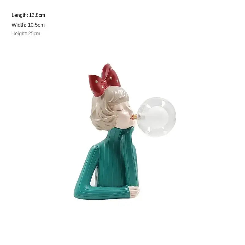 Modern gray and gold bubble girl statue night light featuring a teal ribbed sweater figurine with red polka-dot bow decorbites bubble girl