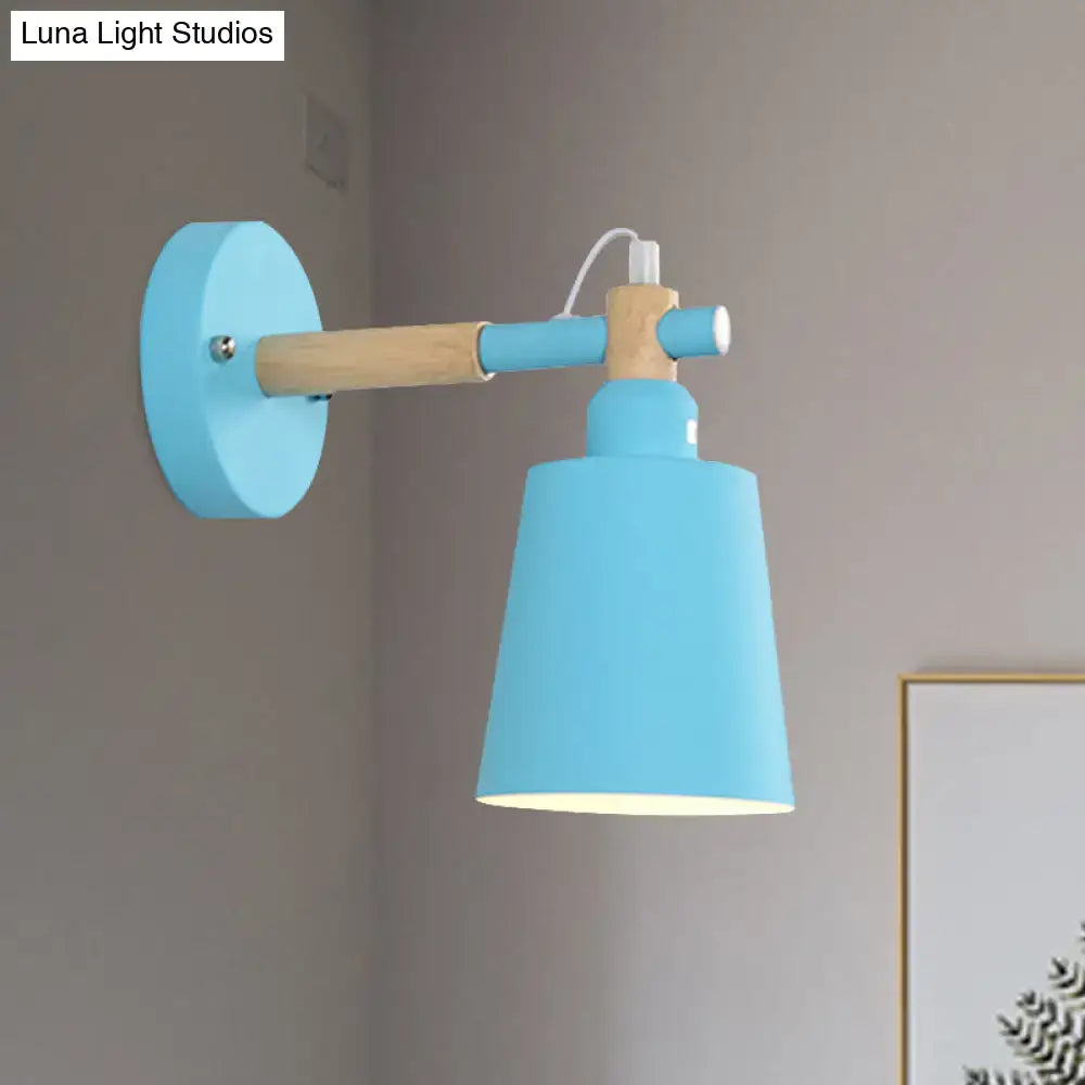 Modern gray and wood wall sconce light with light blue metal shade and wooden arm for bedroom lighting