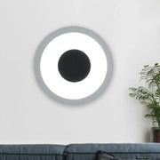 Modern gray and black led circle sconce wall mounted lamp with sleek frame and glowing ring for living room lighting