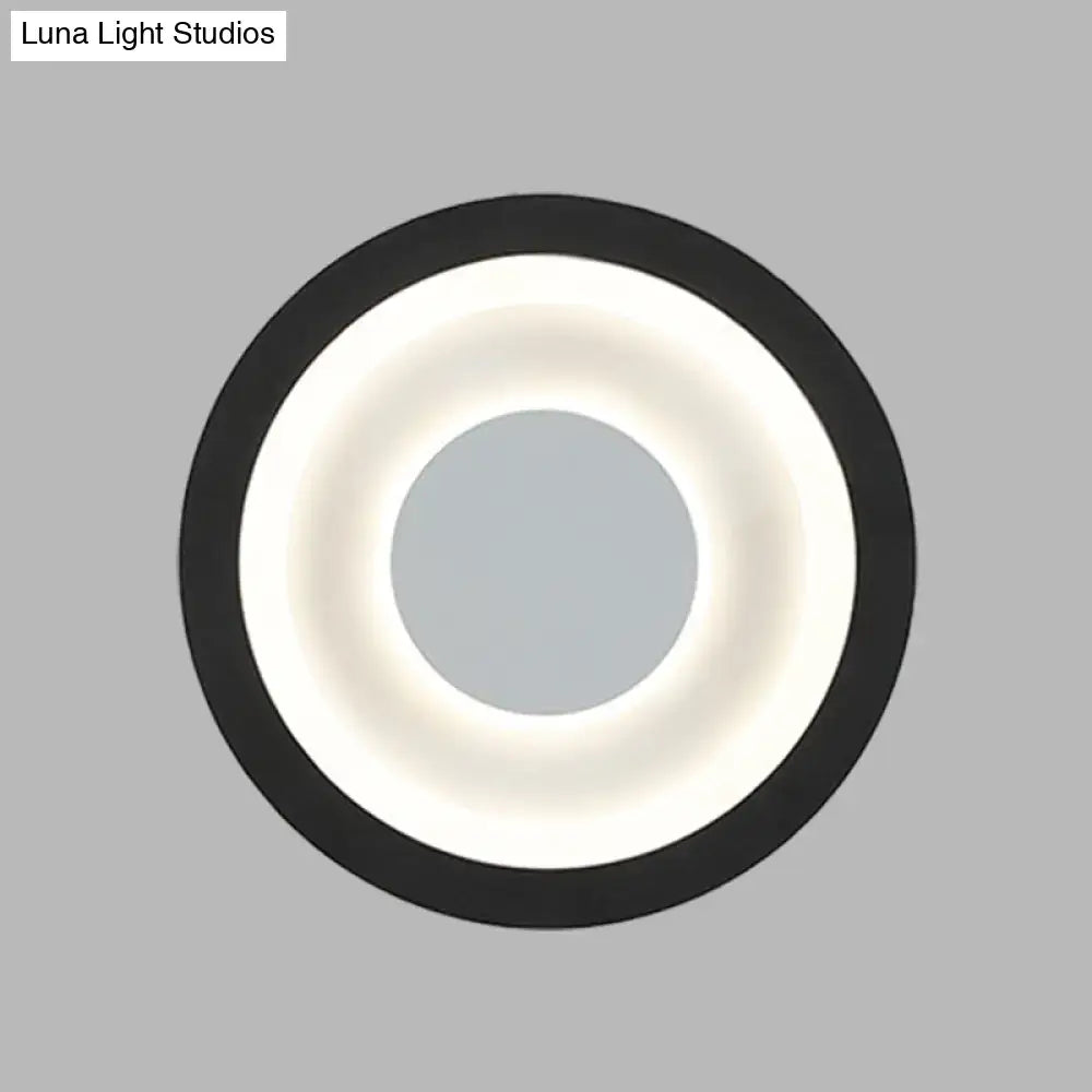 Modern gray and black led circle sconce with glowing white ring wall mounted lamp for living room lighting