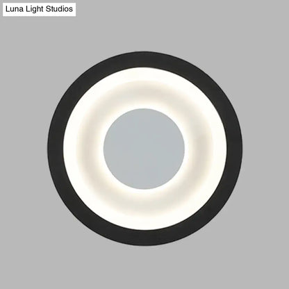 Modern gray and black led circle sconce with glowing white ring wall mounted lamp for living room lighting