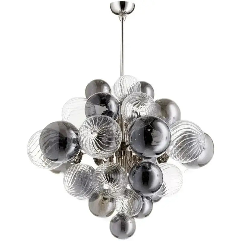 A modern gray and clear bubble glass ceiling chandelier with textured spheres suspended from a silver rod by decorbites bubble glass