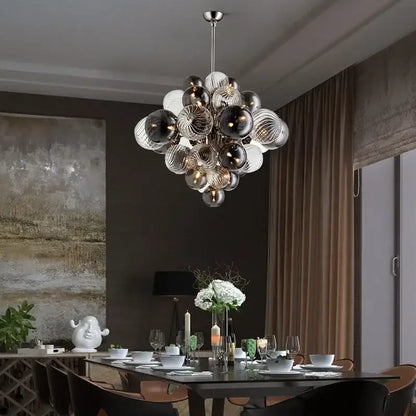 Modern gray and clear bubble glass ceiling chandelier with clear, frosted, and dark mirrored spheres by decorbites bubble glass