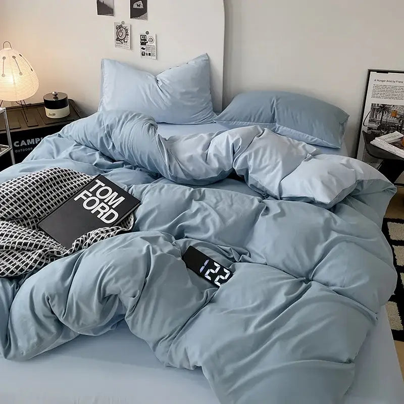Modern gray comforter cover set featuring a light blue plush quilted duvet cover with matching pillows for bedroom bedding