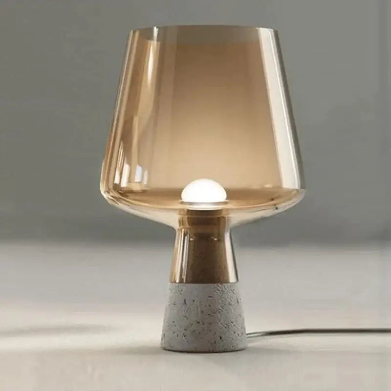 Modern gray glass and concrete table lamp with leimu amber glass shade and gold-toned stem for bedroom decor